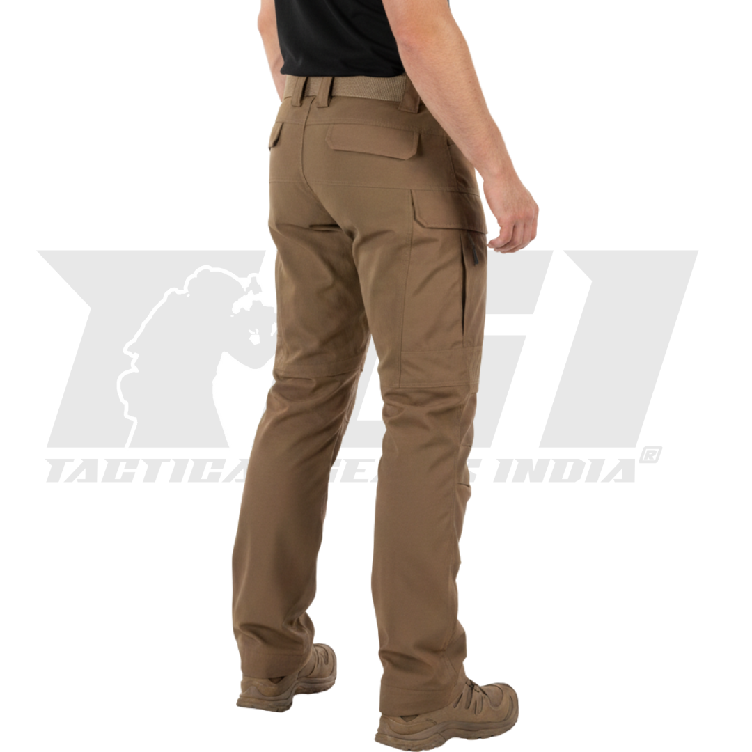 Person performing a dynamic movement, showcasing the flexibility and 4-way stretch of the Special Ops pants.