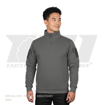 Grey tactical sweatshirt with sleeve zipper pockets and velcro patch panels for winter military operations